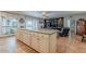 Kitchen island featuring breakfast bar with ample seating, lots of counter space, and opens to the living room at 15327 E Thistle Dr, Fountain Hills, AZ 85268