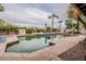 Relaxing pool area with lounge chairs, lush landscaping, and clear water for a refreshing dip at 15327 E Thistle Dr, Fountain Hills, AZ 85268