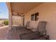 Covered back patio with ceiling fan and a relaxing sitting area at 15334 W Via Montoya --, Sun City West, AZ 85375