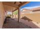 Back patio features ceiling fan, stone pavers, and desert landscaping at 15334 W Via Montoya --, Sun City West, AZ 85375