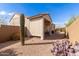 Backyard showcasing covered patio and desert landscaping with cacti at 15334 W Via Montoya --, Sun City West, AZ 85375