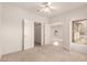 Bright bedroom features neutral carpet, a ceiling fan, and double door closet at 15334 W Via Montoya --, Sun City West, AZ 85375