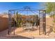 Backyard gazebo with seating, decorative ironwork, and shade at 15334 W Via Montoya --, Sun City West, AZ 85375