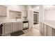 Well-lit kitchen with a mix of appliances and cabinetry with view to another room at 15334 W Via Montoya --, Sun City West, AZ 85375