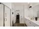 Bright primary bathroom featuring dual vanity, glass shower, modern lighting, and plenty of counter space at 15577 S 181St Ln, Goodyear, AZ 85338