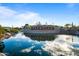 Scenic view of the Estrella community entrance with pond and stone signage at 15577 S 181St Ln, Goodyear, AZ 85338