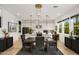 Open floor plan featuring a dining area with a modern chandelier and kitchen island at 15577 S 181St Ln, Goodyear, AZ 85338