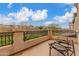 Relax on this spacious balcony with wrought iron railing and enjoy scenic views of the neighborhood and surrounding greenery at 1562 W Lacewood Pl, Phoenix, AZ 85045