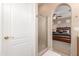 Bathroom showing a glass shower door and partial view of a bedroom with neutral walls and plush carpet at 1562 W Lacewood Pl, Phoenix, AZ 85045