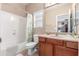 Neutral bathroom featuring a shower-tub combo, single sink, and vanity cabinet at 1562 W Lacewood Pl, Phoenix, AZ 85045