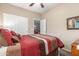 Bright bedroom featuring a sliding closet door, neutral color walls, and bright natural light at 1562 W Lacewood Pl, Phoenix, AZ 85045