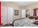 Inviting bedroom with neutral colors, featuring a sliding closet door and bright natural light at 1562 W Lacewood Pl, Phoenix, AZ 85045