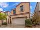 Lovely two-story home with two-car garage and xeriscaping offering low maintenance and attractive curb appeal at 1562 W Lacewood Pl, Phoenix, AZ 85045