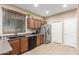 Functional kitchen featuring stainless steel appliances, granite countertops, and abundant natural light at 1562 W Lacewood Pl, Phoenix, AZ 85045