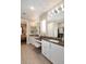 Beautiful bathroom featuring double sinks, great lighting and a seating area at 16935 W Cambridge Ave, Goodyear, AZ 85395