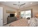 Relaxing bedroom with a view of the pool, a dresser, and soft lighting at 16935 W Cambridge Ave # 57, Goodyear, AZ 85395