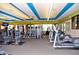 Well-equipped gym featuring weight machines, treadmills, and elliptical trainers in a bright, spacious setting at 16935 W Cambridge Ave, Goodyear, AZ 85395