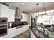 Modern kitchen with stainless steel appliances, a large island, and stylish cabinetry at 16935 W Cambridge Ave, Goodyear, AZ 85395