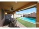 Backyard patio with dining set overlooking pool and desert landscaping under covered patio at 1713 W Cottonwood Ln, Phoenix, AZ 85045