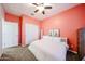 This cozy bedroom features a ceiling fan, modern décor and decorative bunny artwork at 1713 W Cottonwood Ln, Phoenix, AZ 85045