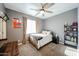 Cozy bedroom with carpet flooring, ceiling fan, and natural light at 1713 W Cottonwood Ln, Phoenix, AZ 85045