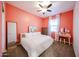 Bedroom with a ceiling fan, and modern decor including decorative bunny artwork, and vanity at 1713 W Cottonwood Ln, Phoenix, AZ 85045