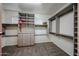 Spacious walk-in closet with custom shelving, drawers, and ample hanging space at 1713 W Cottonwood Ln, Phoenix, AZ 85045