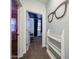 Hallway view leading into bedroom with a fun eyeglasses decoration and shelving display at 1713 W Cottonwood Ln, Phoenix, AZ 85045