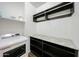 Laundry room with overhead cabinets and granite folding surface at 1713 W Cottonwood Ln, Phoenix, AZ 85045