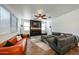 A stylish living room with a modern fireplace, comfortable seating, and plenty of natural light at 1713 W Cottonwood Ln, Phoenix, AZ 85045