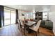 Living and dining area with a fireplace, modern furnishings, and sliding glass doors to an outdoor patio at 1713 W Cottonwood Ln, Phoenix, AZ 85045