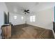 Cozy loft area featuring carpet, natural light, and a ceiling fan at 1713 W Cottonwood Ln, Phoenix, AZ 85045