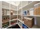 Well-organized pantry with white shelving, ample storage, and a variety of food items at 1713 W Cottonwood Ln, Phoenix, AZ 85045