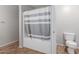 Bathroom with a gray-and-white striped shower curtain and a toilet at 17751 W Bloomfield Rd, Surprise, AZ 85388