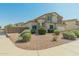 Well-maintained home with desert landscaping and a beautiful, clear blue sky at 17751 W Bloomfield Rd, Surprise, AZ 85388