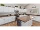 Well-equipped kitchen boasts granite countertops and modern appliances at 17751 W Bloomfield Rd, Surprise, AZ 85388