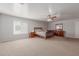 Bright main bedroom offers a ceiling fan and ample natural light at 17751 W Bloomfield Rd, Surprise, AZ 85388