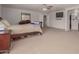 Serene main bedroom with a ceiling fan, dresser, and a large window at 17751 W Bloomfield Rd, Surprise, AZ 85388