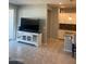 Open-concept living area with stylish white accents and a view of the kitchen at 18642 W Yucatan Dr, Surprise, AZ 85388