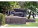 Hesapeake Condominiums community sign on a brick base surrounded by green lawn and trees at 200 E Southern Ave # 316, Tempe, AZ 85282