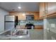 Well-lit kitchen featuring stainless steel appliances and granite countertops at 200 E Southern Ave # 316, Tempe, AZ 85282