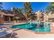 Community pool surrounded by lounge chairs and lush landscaping at 200 E Southern Ave # 316, Tempe, AZ 85282