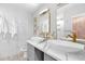 Elegant bathroom with dual vessel sinks, gold hardware, and marble accents for a spa-like experience at 2026 E Duke Dr, Tempe, AZ 85283