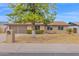 Charming single-Gathering home with a two-car garage and mature landscaping at 2026 E Duke Dr, Tempe, AZ 85283