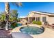 Beautiful backyard featuring a pool, spa, lush landscaping, and inviting atmosphere at 20640 N 100Th Ln, Peoria, AZ 85382