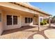 Inviting covered patio with brick pavers and security doors, perfect for outdoor relaxation at 20640 N 100Th Ln, Peoria, AZ 85382