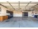 Spacious garage with ample storage cabinets and overhead lighting at 20640 N 100Th Ln, Peoria, AZ 85382