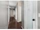 Hallway featuring sleek, modern design and access to a pantry with decorative door at 20640 N 100Th Ln, Peoria, AZ 85382
