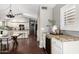 Stylish kitchen area featuring granite countertops, a wine cooler, and modern appliances at 20640 N 100Th Ln, Peoria, AZ 85382