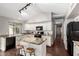Well-equipped kitchen featuring granite countertops, white cabinetry, and modern black appliances at 20640 N 100Th Ln, Peoria, AZ 85382